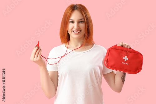 Female lifeguard with whist...
