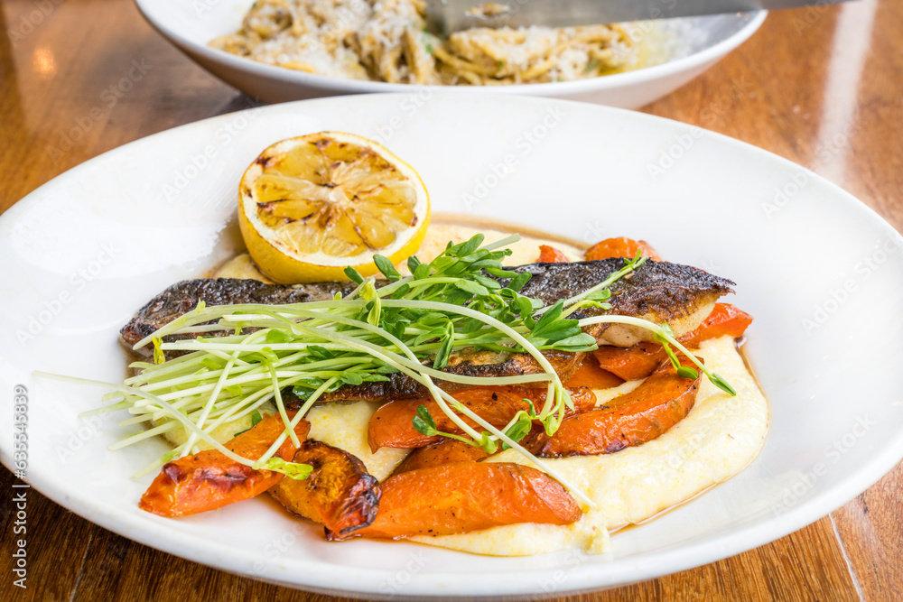 Bronzino Fish and Polenta, Housemade pasta, .Calgary Downtown.Stampede Festival.Banff National Park, Canadian Rockies, Alberta, Canada...Banff National Park, Alberta, Canada