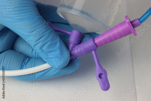 Obraz na plátně Close up view enteral feeding tube with infusion set connected and syringe with water in the other way