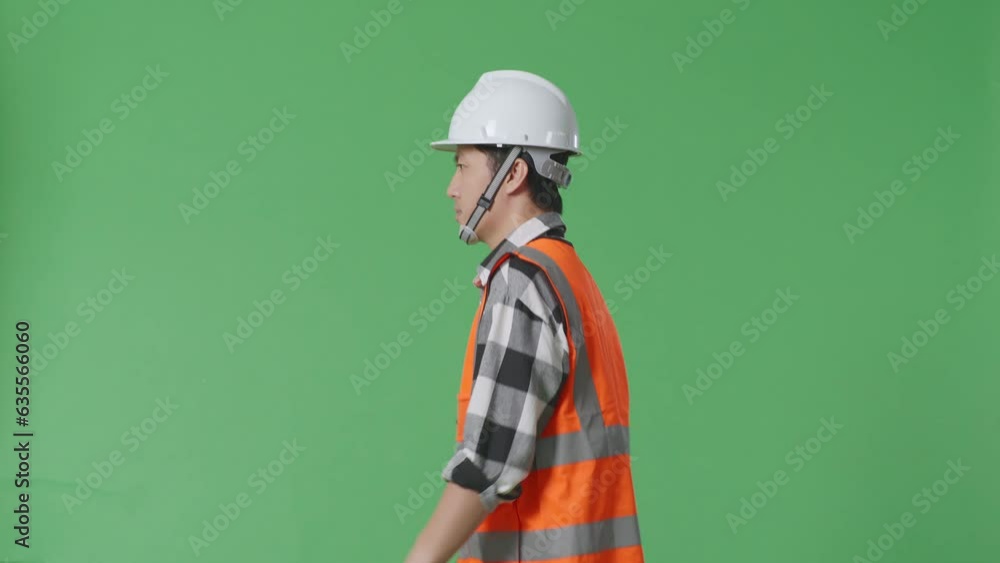Side View Of Asian Male Engineer With Safety Helmet And Walking In The Green Screen Background Studio
Side View Of Asian Male Engineer With Safety Helmet And Walking In The Green Screen Background Studio