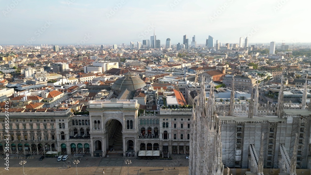 Europe, Italy, Milan - Aerial view of Piazza Duomo, gothic Cathedral in downtown center city. Drone aerial view of Vittorio Emanuele gallery and new skyline  - Duomo Unesco Heritage sightseeing 