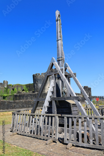 Caerphilly Castle  in Caerphilly in South Wales United Kingdom and catapult is a ballistic device used to launch a projectile a great distance without the aid of gunpowder or other propelants
