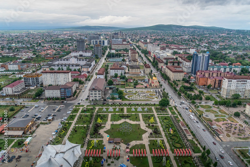 The panorama view on Grozny city, park, downtown building, and residential areas in the the capital of Chechen Republic, Southern Russia, during the grey cloudy rainy day. photo