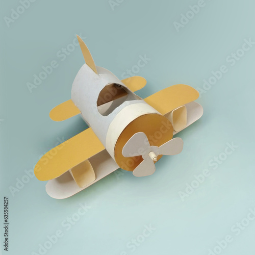 The idea of recycling a roll of toilet paper into a toy airplane. Craft idea for children's creativity