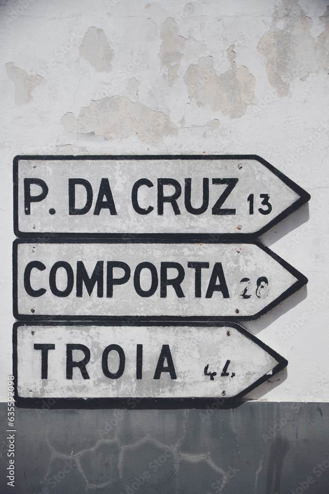Road signs in Melides, Alentejo, directing the way to Pinheiro da Cruz, Comporta, and Troia. Road signs in Melides, Alentejo, directing the way to Pinheiro da Cruz, Comporta, and Troia.