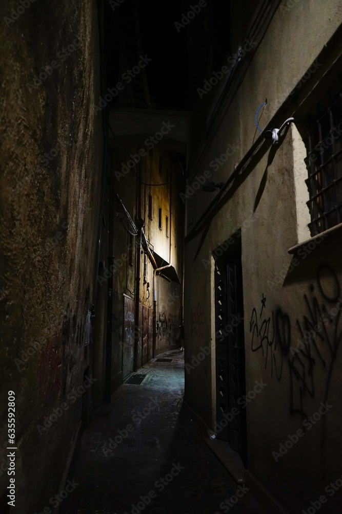 Gloomy narrow street at the night in Terni, Umbria, Italy
