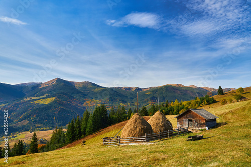 Autumn Morning in the Mountains: A Serene Village in the Valley Surrounded by Majestic Peaks