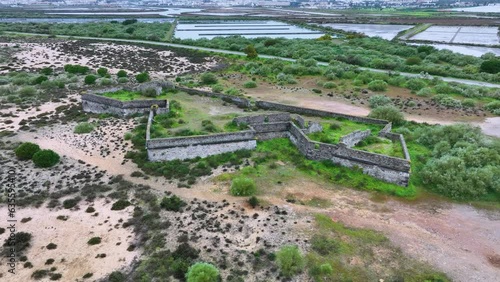 São João da Barra fort. Aerial view from a drone. Tavira cabins. Lighthouse district. Marshes and salt flats of the Ria Formosa Natural Park. Atlantic Ocean. Algarve. Portugal. Europe