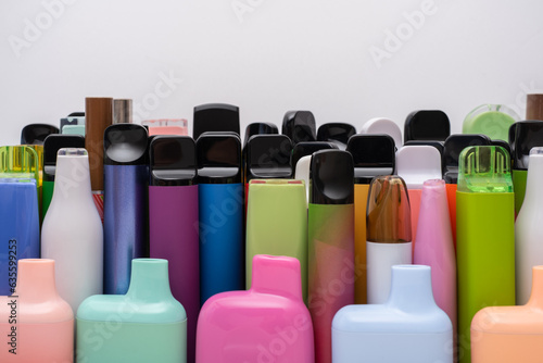 Synthetic nicotine concept. Various disposable electronic cigarettes. modern alternative smoking, vaping and nicotine. Close up