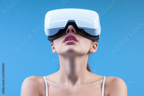 Woman with virtual reality headset isolated on blue background. VR, future, gadgets, technology concept