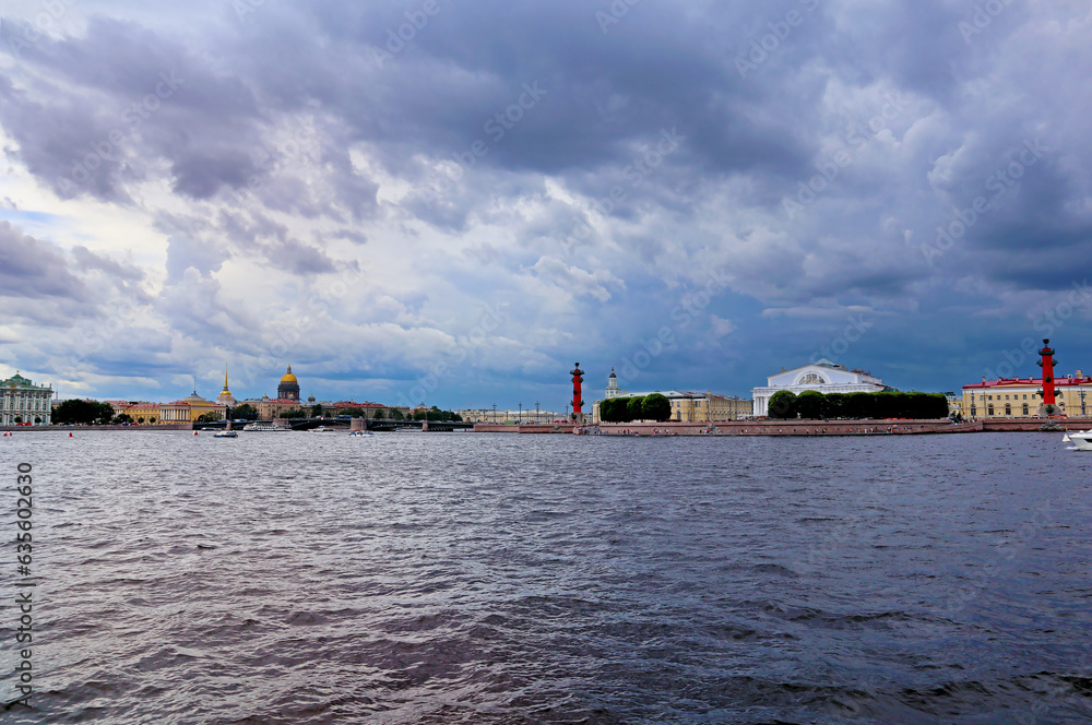 Panorama with Neva river and embankment in St. Petersburg, Russia. Beautiful view of the Palace bridge and water surface on a cloudy sky background.