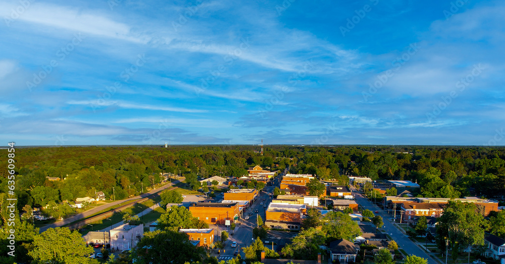 Aerial view of a small town Main Street on a beautiful day.