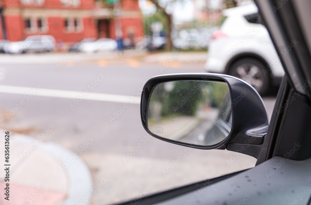 Car mirror: Reflection of journey, introspection, and transitions in a compact frame, capturing the road of life