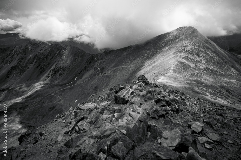 Mountain peak black and white Grays and Torreys Colorado 14er landscape photography hiking trek tourist destination clouds and Rocky Mountains outdoors