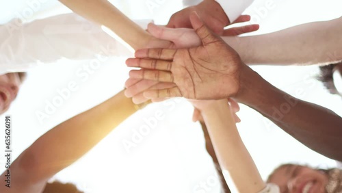 Young happy people put their hands together. Community of multiethnic people supporting each other - Diverse culture