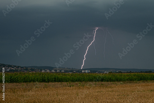 Bright lightning discharge over the city of Targu Mures in Romania