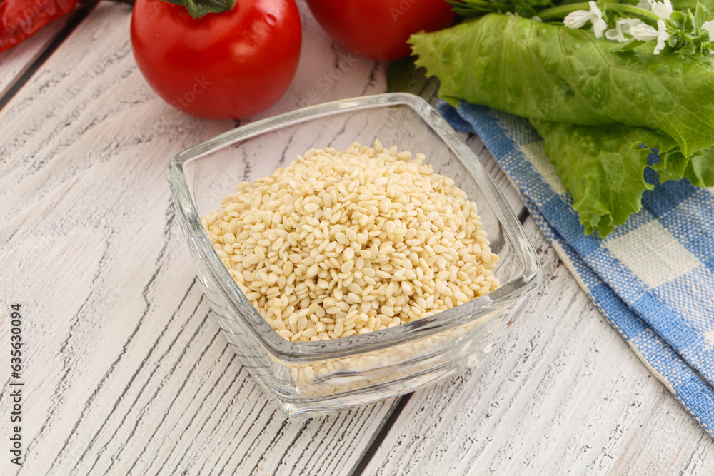 Raw sesame seeds in the bowl Raw sesame seeds in the bowl