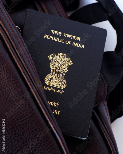 indian national blue passport on a traveling bag in close up photo