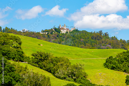 Hearst Castle on top of the mountain. Hearst Castle is a National Historic Landmark and California Historical Landmark. Panoramic bottom up view of Hearst Castle. Landmarks of California in America photo