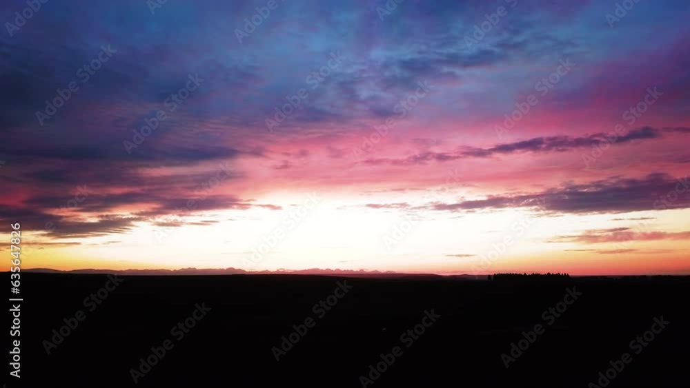 Aerial Forward Shot Of Silhouette Landscape Against Cloudy Orange Sky At Sunset - Billings, Montana Aerial Forward Shot Of Silhouette Landscape Against Cloudy Orange Sky At Sunset - Billings, Montana