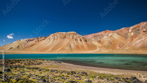 Estamos viendo colores intensos , y una majestuosa parte del  lago q se encuentra a 3.300 metros de altura del nivel del mar , llamado laguna del diamante , ubicada en San Carlos provincia de Mendoza. photo