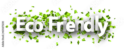Eco friendly sign over green cut out foil ribbon confetti background.