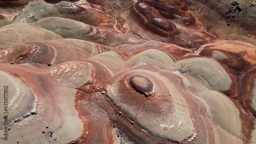 Aerial-Top down-Pulling back over view of Bentonite Hills with brilliant colored bands of bentonite clay in scalloped patterns, a beautiful display of nature's handiwork.