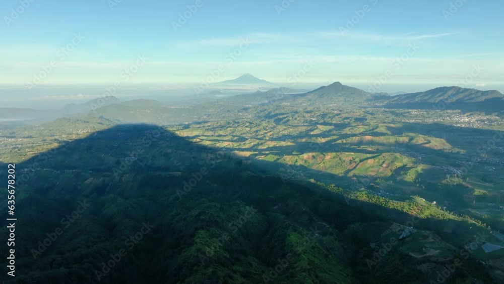 Aerial View of Mount Slamet in the distance from the summit of Mount Bisma in Central Java, Indonesia. Aerial View of Mount Slamet in the distance from the summit of Mount Bisma in Central Java, Indonesia.