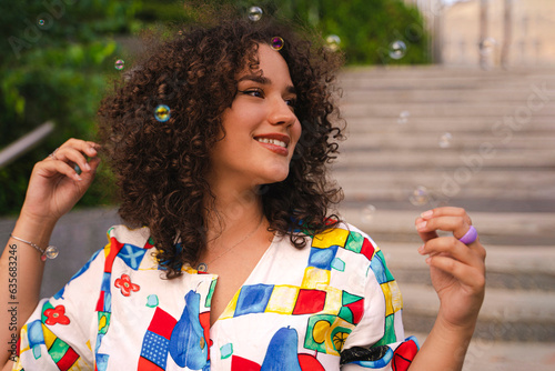 Young stylish female portrait, smiling outdoors