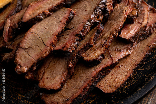 Tableau sur toile Sliced smoked brisket on a serving plate with toast