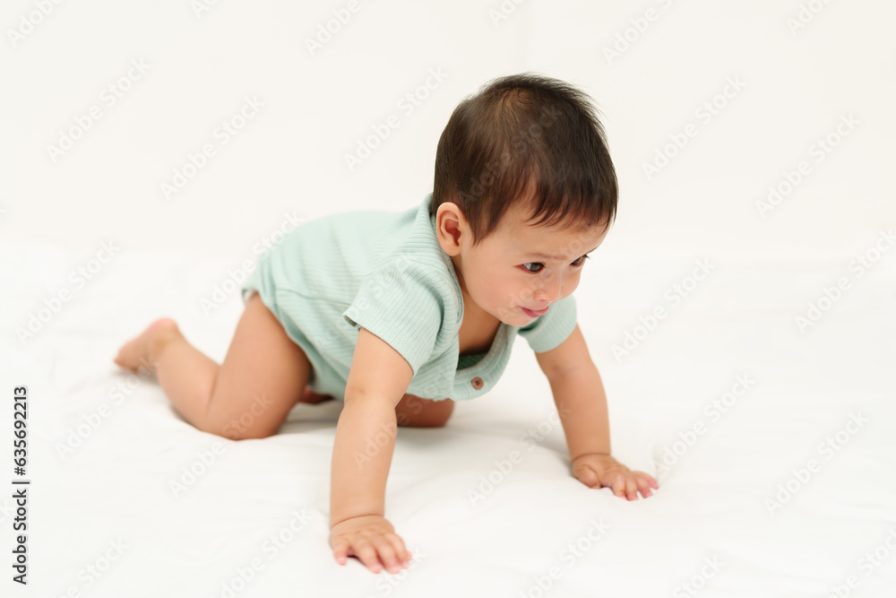 happy infant crawling on floor inside baby playpen happy infant crawling on floor inside baby playpen