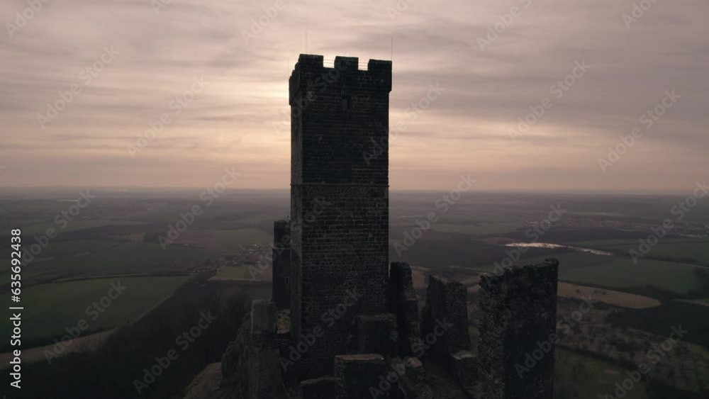 Medieval Hazmburk Castle ruin on hilltop high above village, drone aerial view Medieval Hazmburk Castle ruin on hilltop high above village, drone aerial view