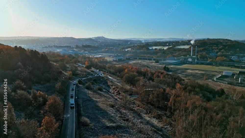 Car driving along a road showing sunlight distant fog. Aerial drone view following cars along the road.
aerial photography. Car driving along a road showing sunlight distant fog. Aerial drone view following cars along the road.
aerial photography.