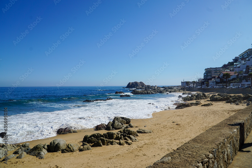 Scenic view from Viña del Mar's coastline to the beach on a beautiful sunny day.