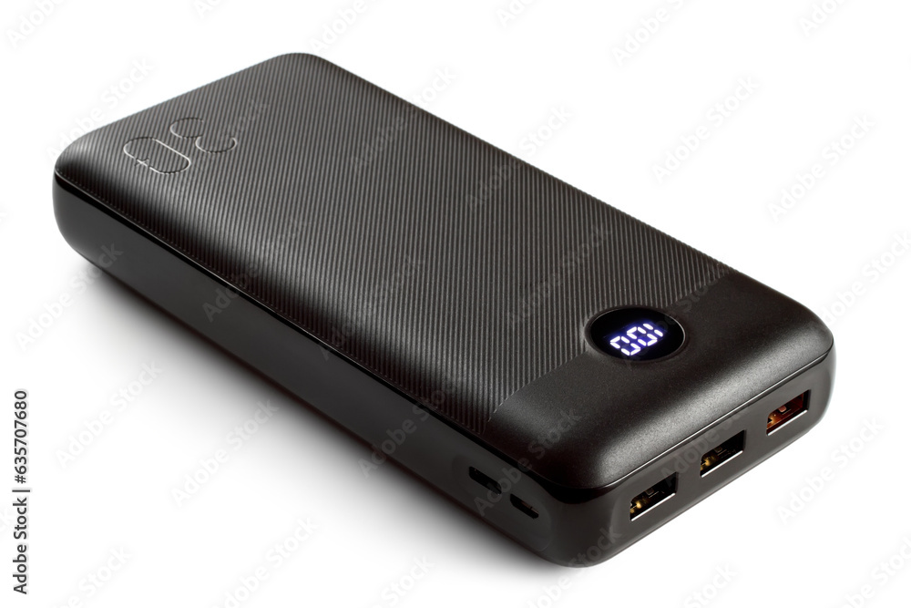 A modern power bank with charge indication on a white background. Battery for charging devices. A modern power bank with charge indication on a white background. Battery for charging devices.