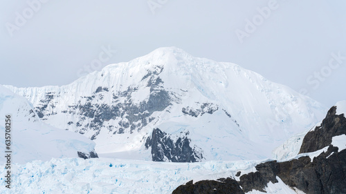 Antarctica mountains and sea. South Pole. On cloudy day