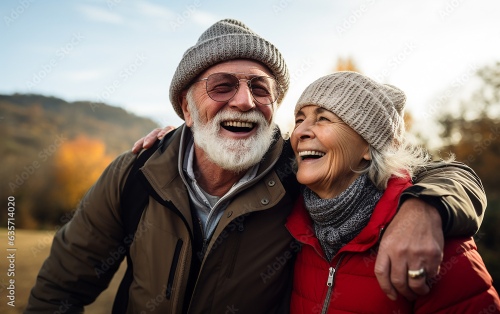 Happy smiling active senior couple, retired husband and wife having fun outdoors