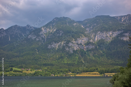Beautiful foggy and cloudy landscape with a lake and mountains in summer. Natural colorful background. Lake Traunsee is very popular as a health and holiday resort. Gmundnerberg, Upper Austria.