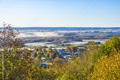 Landscape view with mist and autumn colors