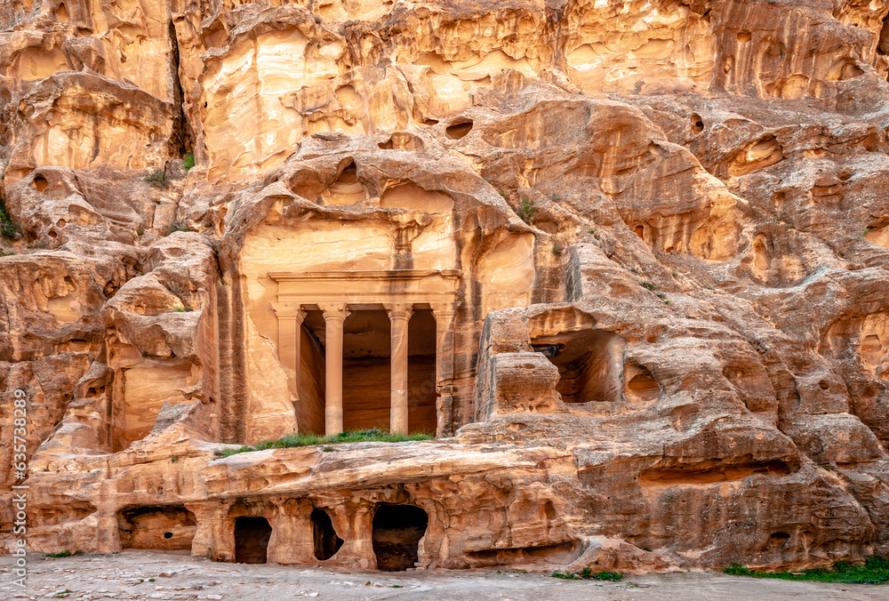 Naklejka premium Temple above cave rooms, carved into sandstone in Siq Al-Barid, Little Petra, Jordan.