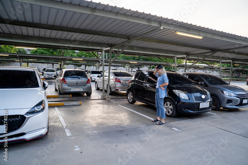 Sad woman with empty parking space. Concept lost car.