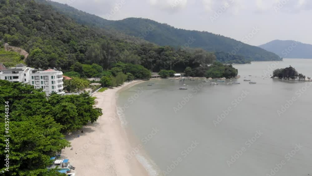 Aerial view of beautiful Batu Ferringhi beach nearby greenery Aerial view of beautiful Batu Ferringhi beach nearby greenery