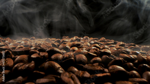 Aromatic, coffee roasted grains on a dark background.