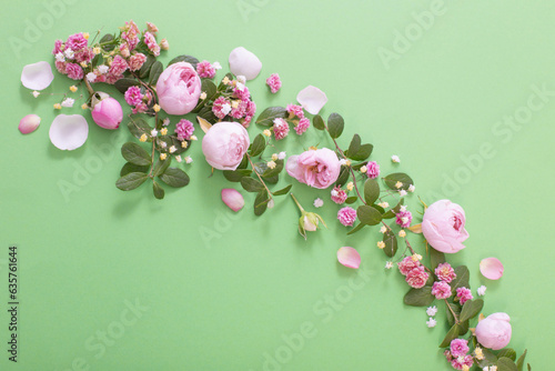 pink flowers and green leaves on green background