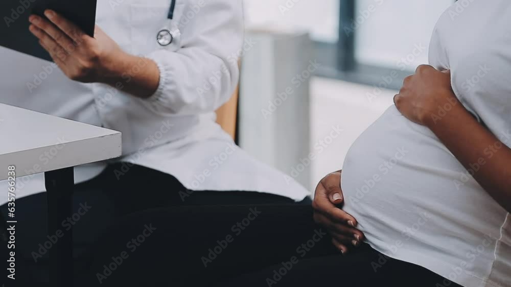 Happy pregnant woman visit gynecologist doctor at hospital or medical clinic for pregnancy consultant. Doctor examine pregnant belly for baby and mother healthcare check up. Gynecology concept. Happy pregnant woman visit gynecologist doctor at hospital or medical clinic for pregnancy consultant. Doctor examine pregnant belly for baby and mother healthcare check up. Gynecology concept.