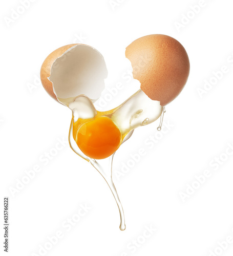 Chicken egg shell cracked in half,  egg yolk and white dropping out