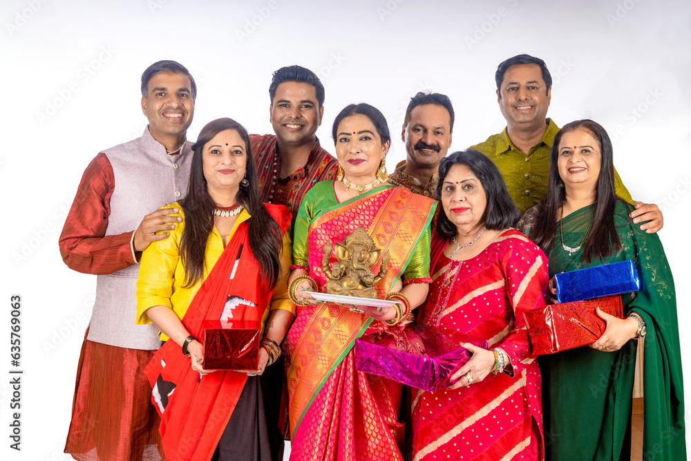 indian family celebrate lord ganesha festival together