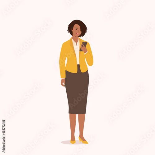 One Smiling Black Businesswoman Using Her Mobile Phone While Standing. Full Length.