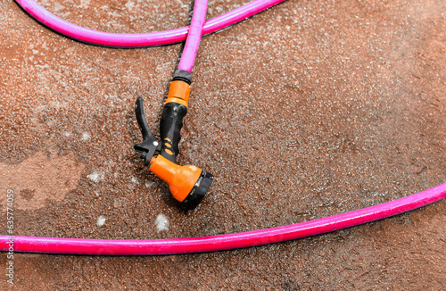 Water spay gun and pipe on wet ground, Washing tool