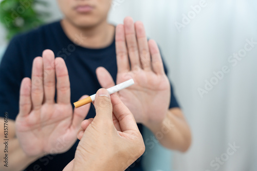 No smoking. Man stop smoke  refuse  reject  break take cigarette  say no. quit smoking for health. world tobacco day. drugs  Lung Cancer  emphysema   Pulmonary disease  narcotic  nicotine effect